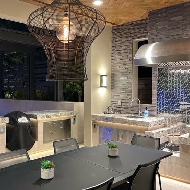Outdoor Kitchen with BBQ Under Patio Structure