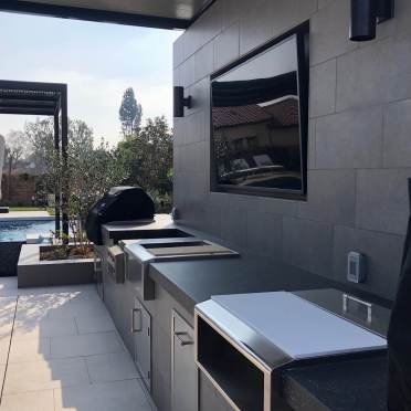 Modern Outdoor Kitchen with Media Wall