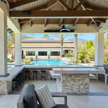 Outdoor Kitchen with BBQ Under Patio Cover