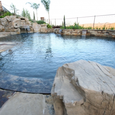 Rock and Natural Stone Swimming Pool with Overflow Edge