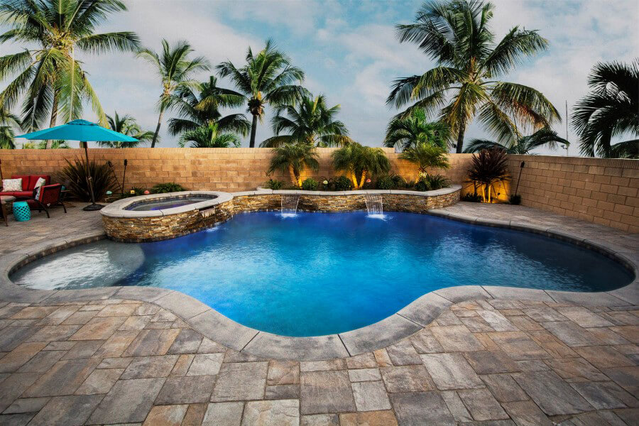 Freeform Traditional Pool with Stone Wall and Spa