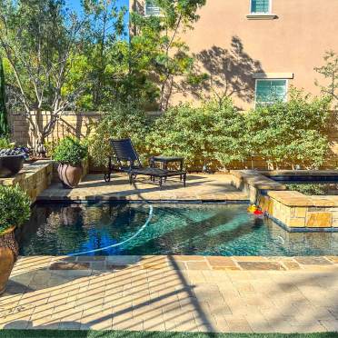 Traditional Stone Rectangle Swimming Pool and Spa